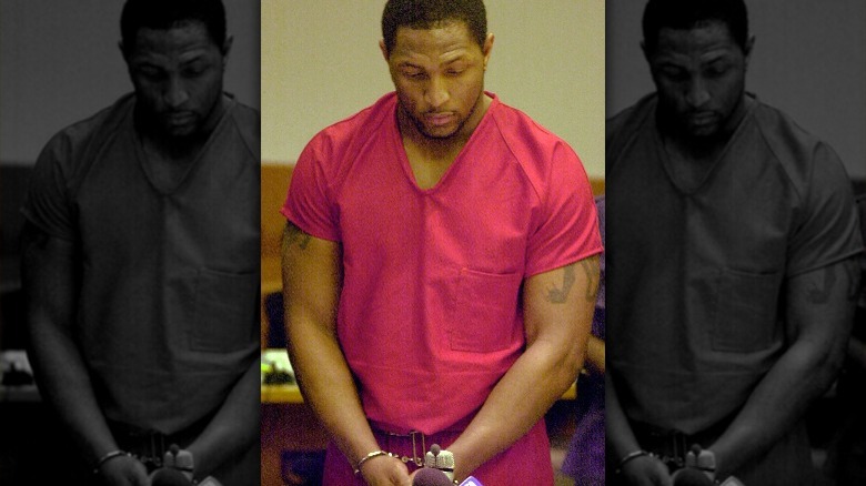 Lewis in court handcuffed