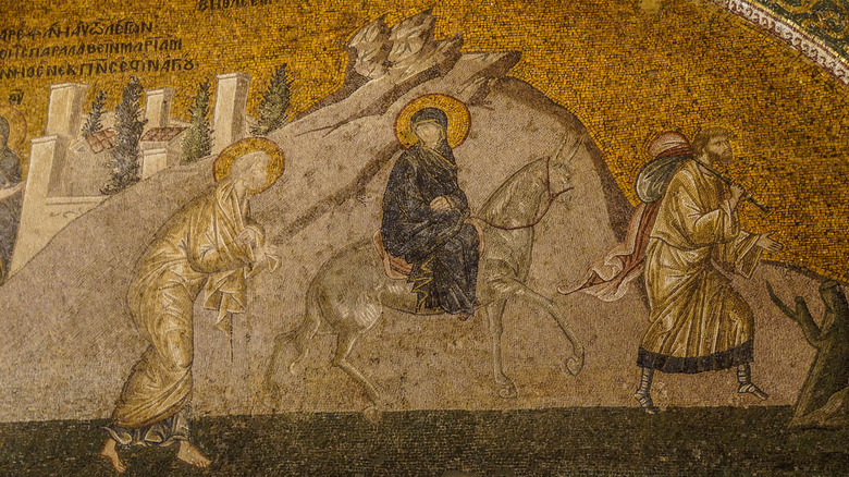 Joseph and Mary travelling on donkey