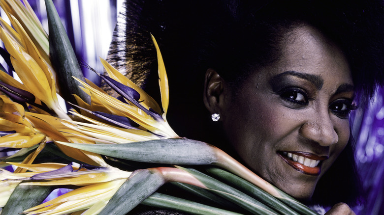 Patti LaBelle holding flowers