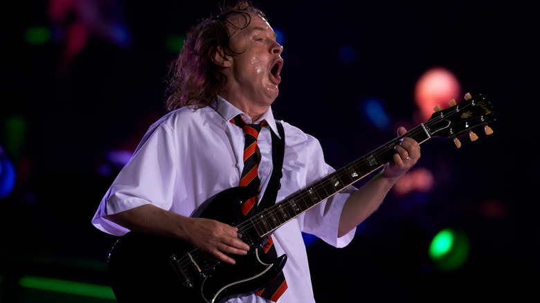 Angus Young of AC/DC playing onstage