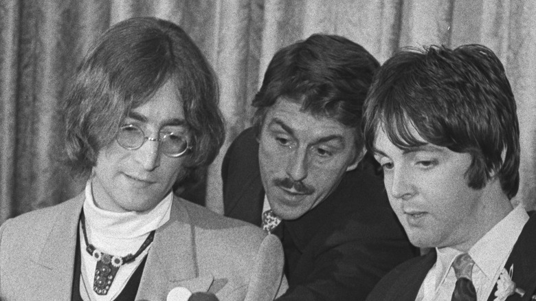 John, Paul and Derek Taylor talking