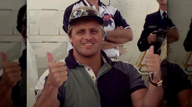 Owen Hart smiling baseball cap thumbs up