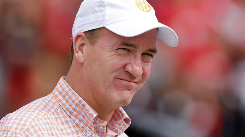 Peyton Manning smiling in hat