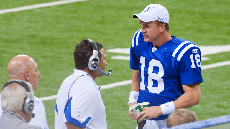 Peyton Manning talking to coach