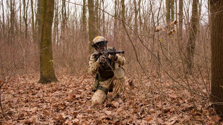 soldier aiming a gun