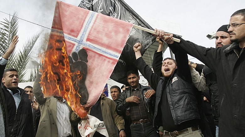 Protestors burning the Danish flag