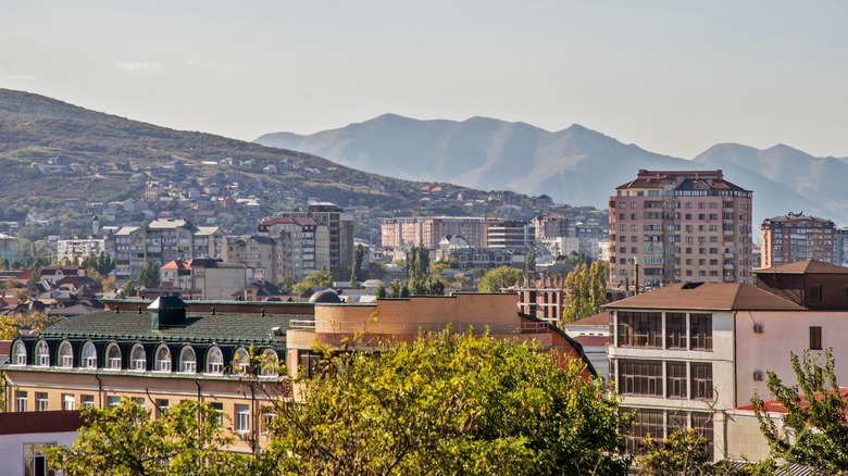 Buildings in front of mountains