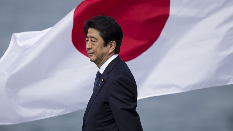 Shinzo Abe in front of Japanese flag