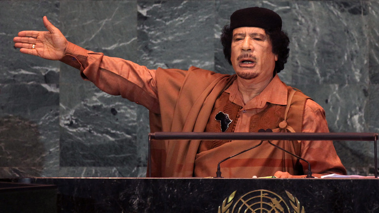 Gaddafi in brown robe gesticulating at UN summit