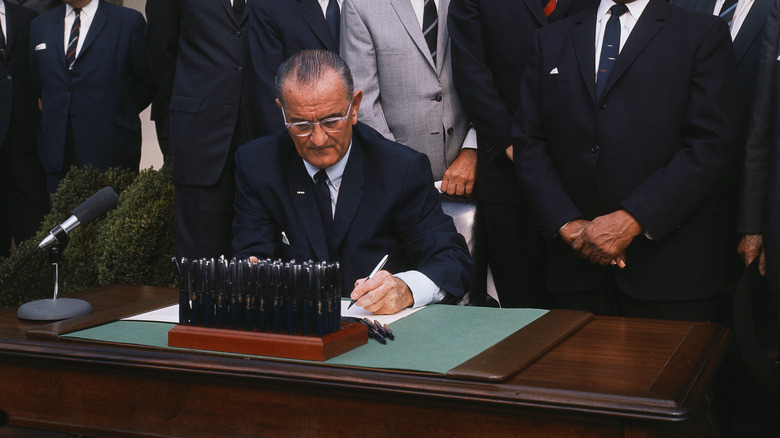 Lyndon B. Johnson signing the Civil Rights act