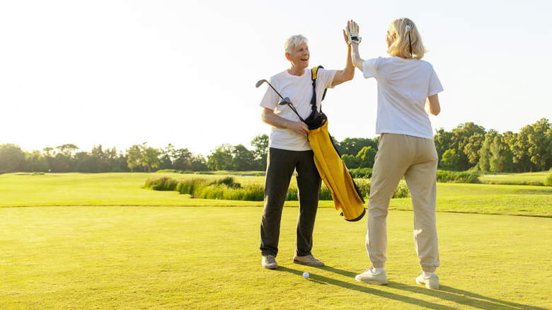 older couple golfing