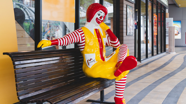 Ronald McDonald on a bench