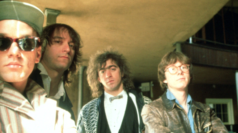 The members of R.E.M. posing for a photo