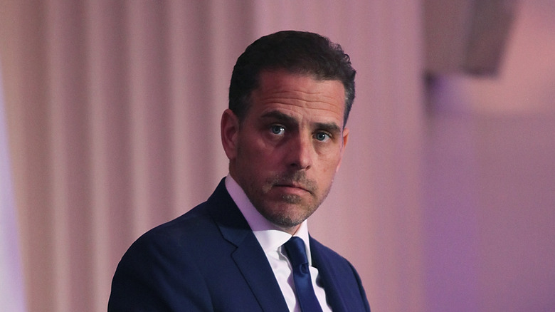 Hunter Biden blue suit tie looking right