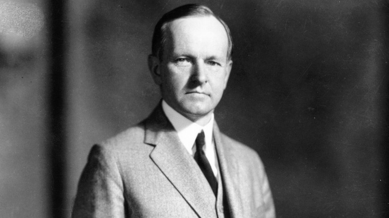 Calvin Coolidge posing for a photo