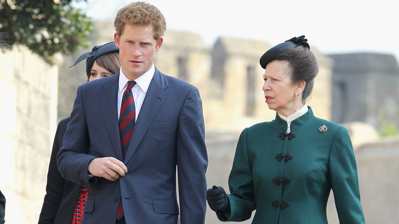 Princess Anne walking with Prince Harry