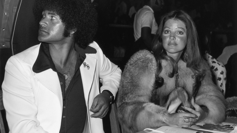 Priscilla Presley Mike Stone sitting at a table