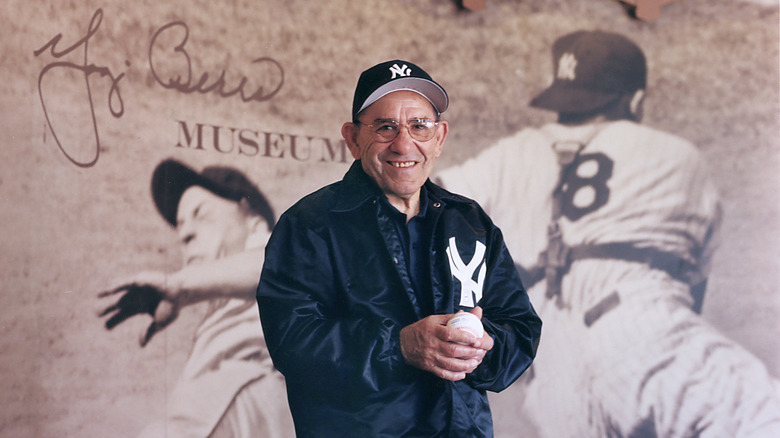 Yogi Berra posing for cameras