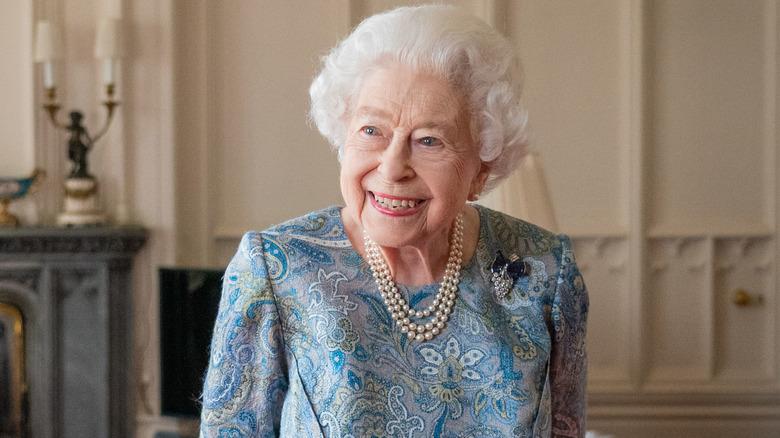 Queen Elizabeth II in pearls smiling