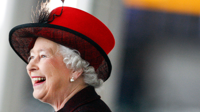 Queen Elizabeth II red hat 