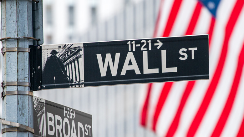 Wall Street sign rests in Manhattan