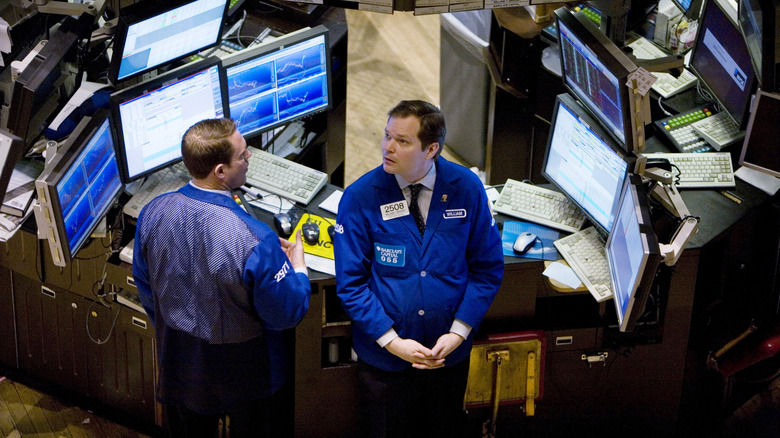 two traders new york stock exchange by monitors 2008