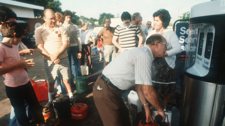 People loading gas in 1970s