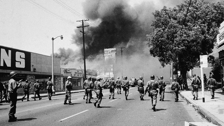 Watts riots national guard with guns rising smoke