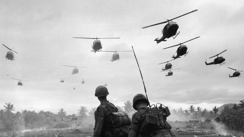 Helicopters fly over soldiers Vietnam