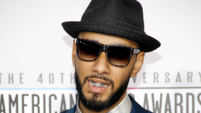 Swizz Beatz in sunglasses and hat