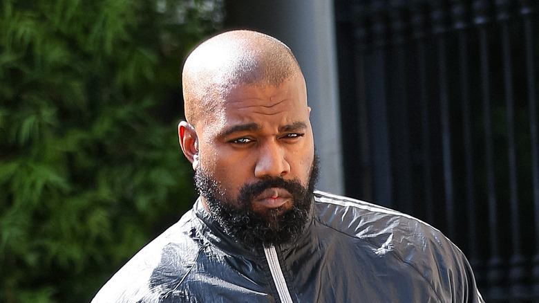 Kanye West outside beard solemn