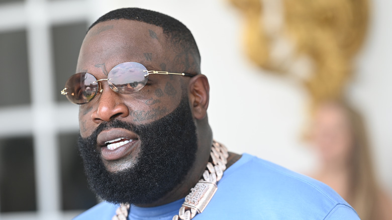 Rick Ross sunglasses blue shirt