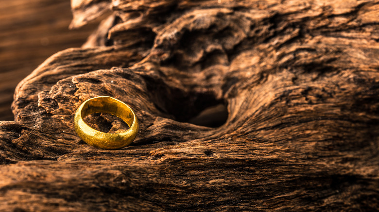 gold ring on a wooden background