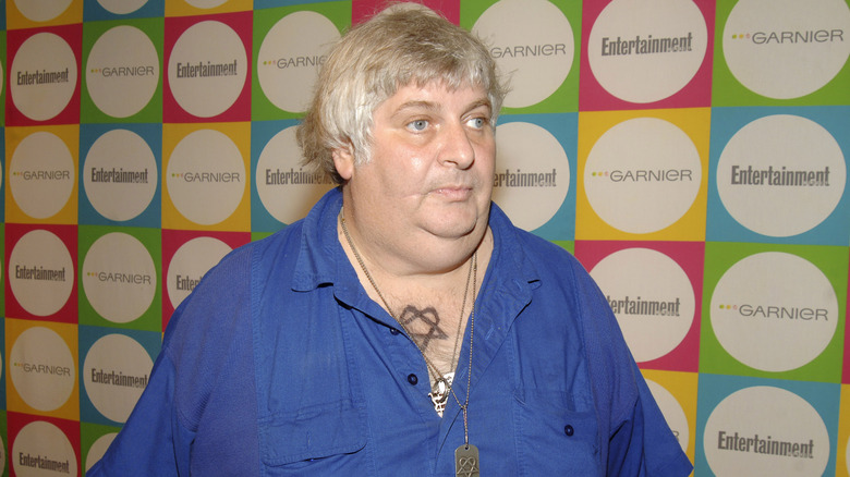 Vincent Margera blue shirt necklace at event