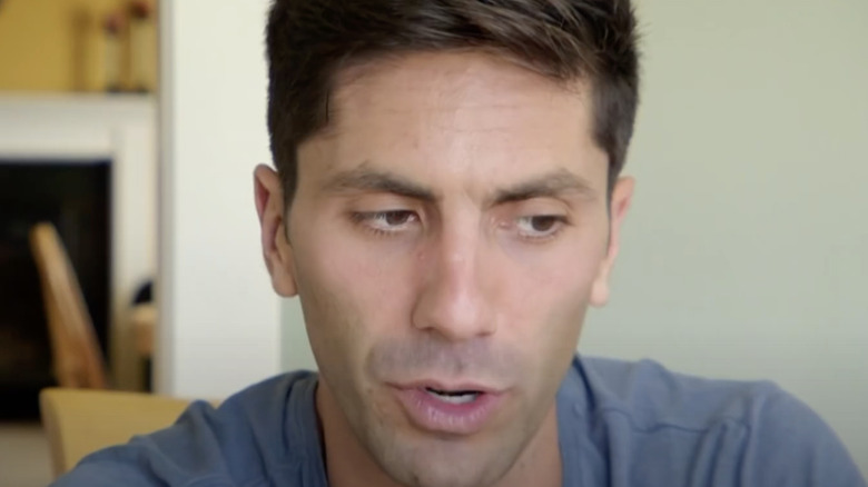 nev schulman looking away at desk on catfish