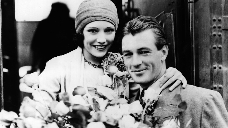 Lupe Vélez and Gary Cooper surrounded by flowers