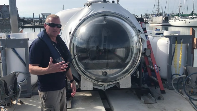 David Lochridge standing in front of the Cyclops submersible