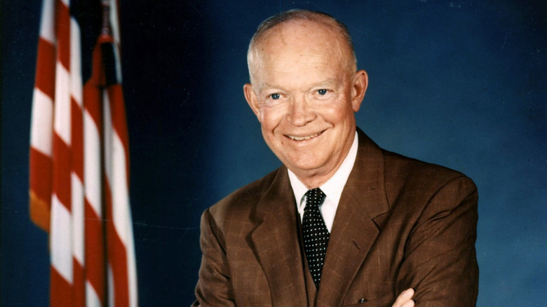 Dwight Eisenhower standing brown suit smiling