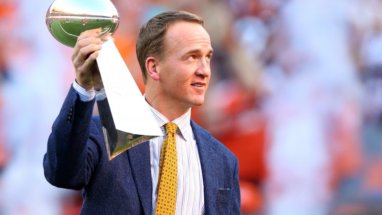 Peyton Manning holding trophy