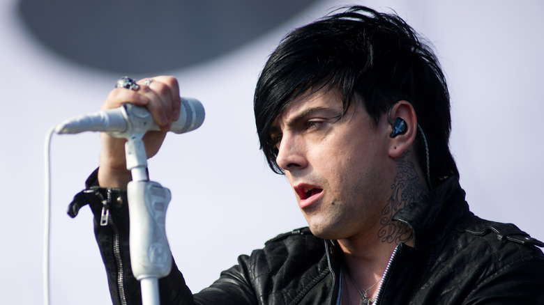 Ian Watkins black hair and white microphone