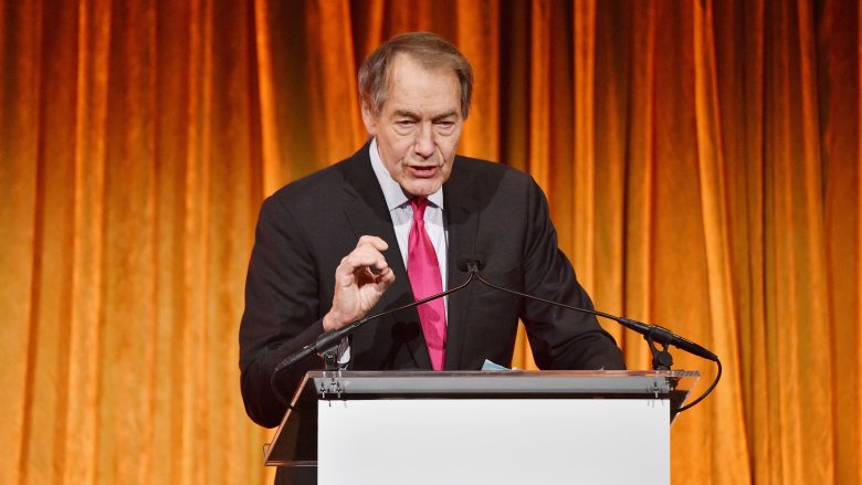 charlie rose speaking at a lecturn