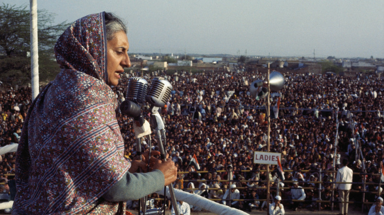 Indira Gandhi speaking to a huge crowd outside