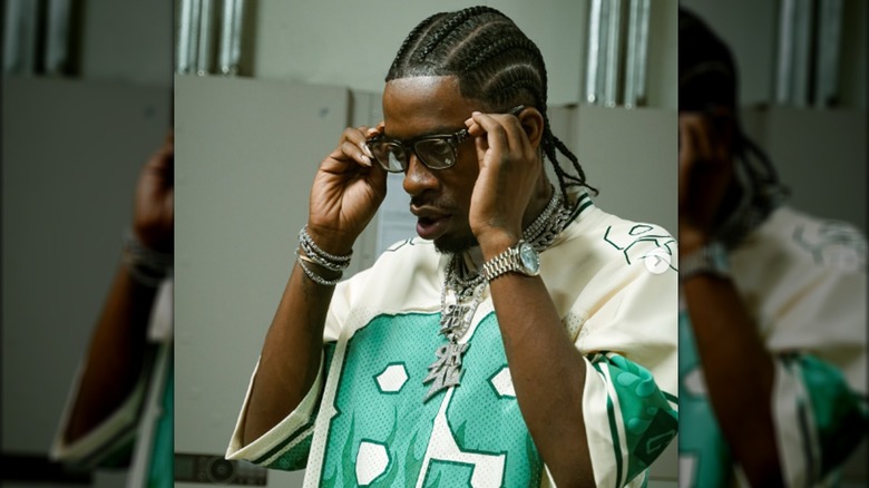 Rich Homie Quan checking glasses