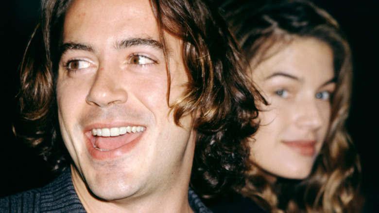 Robert DOwney Jr. smiling with Deborah Falconer in the background