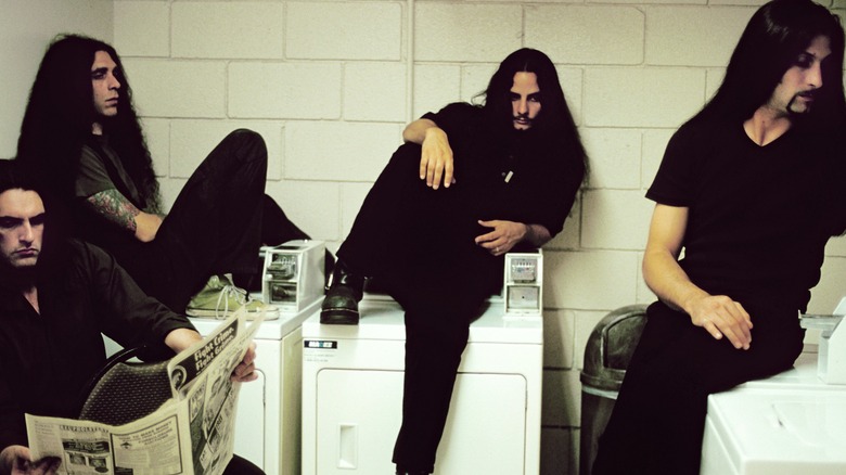 Type O Negative member posing in a coin laundry mat.