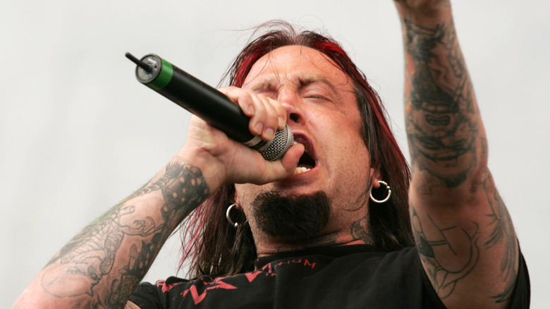 Drowning Pool's Jason "Gong" Jones singing on stage