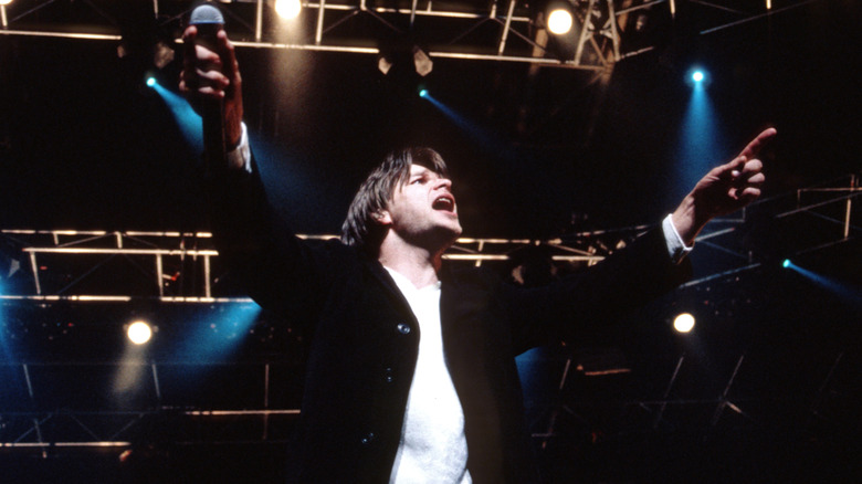 Ray Wilson performing on stage with Genesis in Germany in 1998