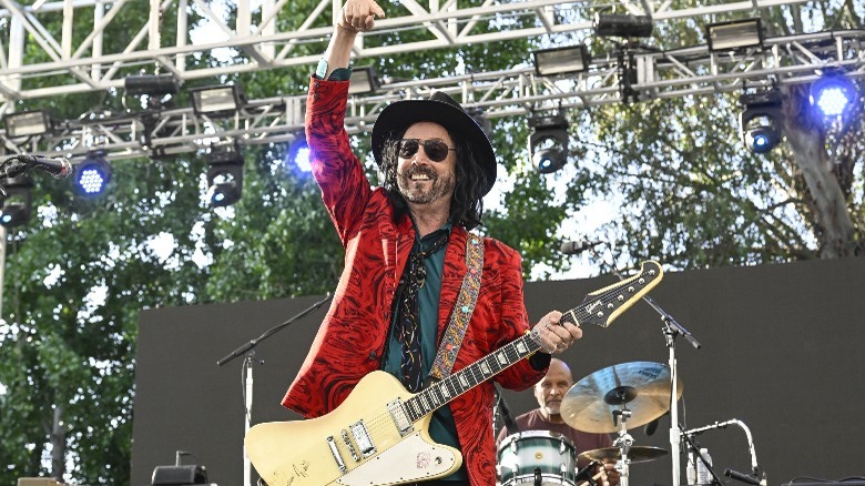 Mike Campbell playing guitar onstage 2023