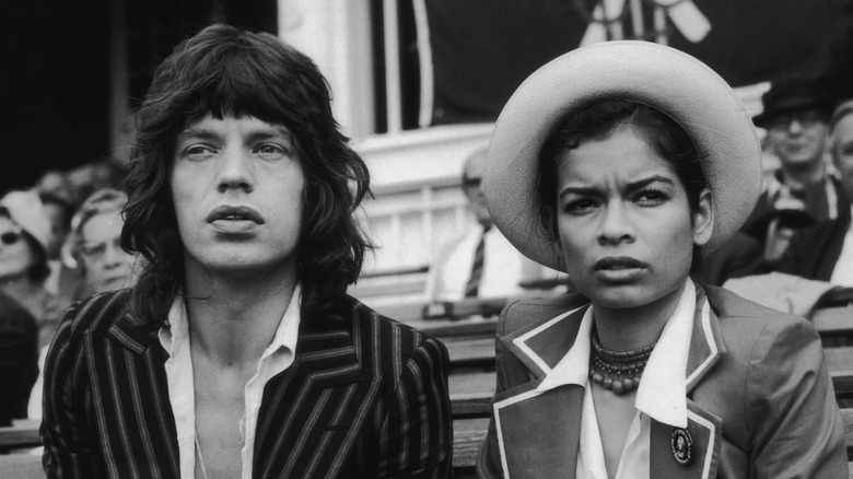 mick jagger and bianca jagger sat in bleachers