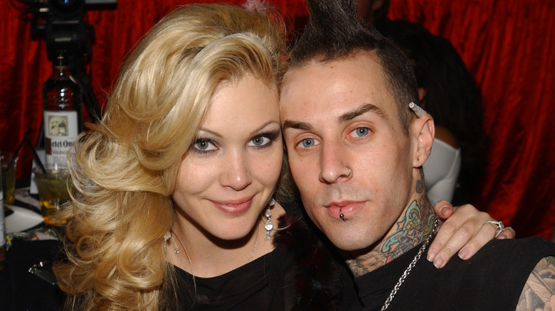 shanna moakler travis barker smiling at event